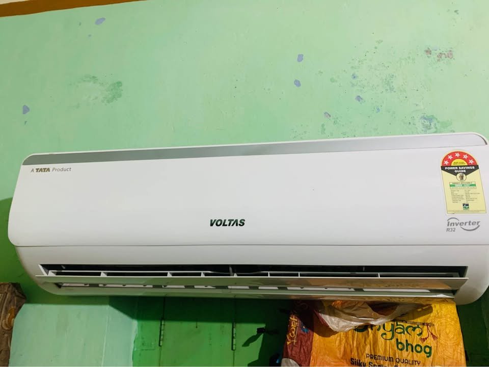Front view of Voltas Vectra Elite 1.5 ton 5 star AC showing open airflow flap and vents for air distribution
